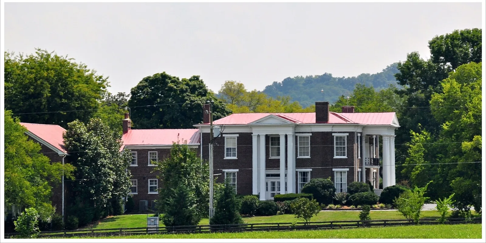 The James Johnston House, also called Isola Bella, a brick house with a two-story columned portico beside Franklin Road (U.S. 31) in Brentwood.