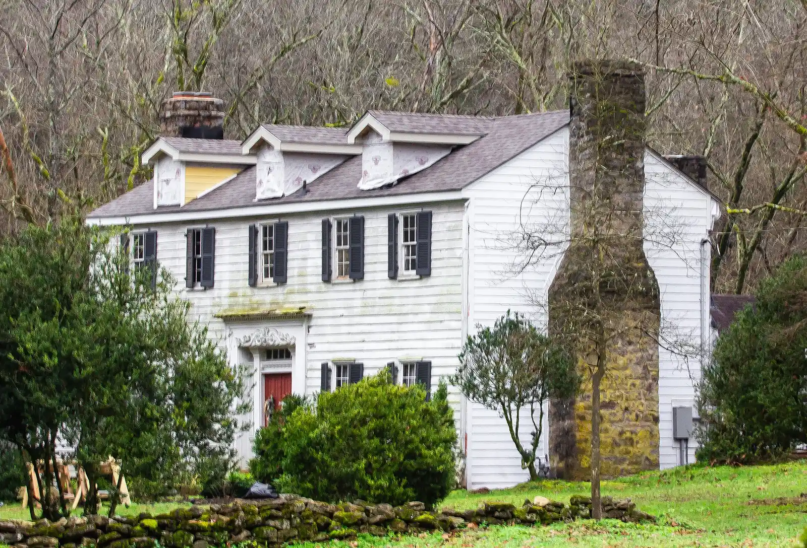 The Joseph Elliston House, a two-story white frame house with a stone chimney in Brentwood