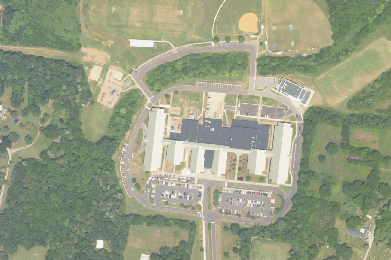 The long school building on Sunset Trail shared by Sunset Elementary and Sunset Middle schools, east of Brentwood, seen from the air in 2023
